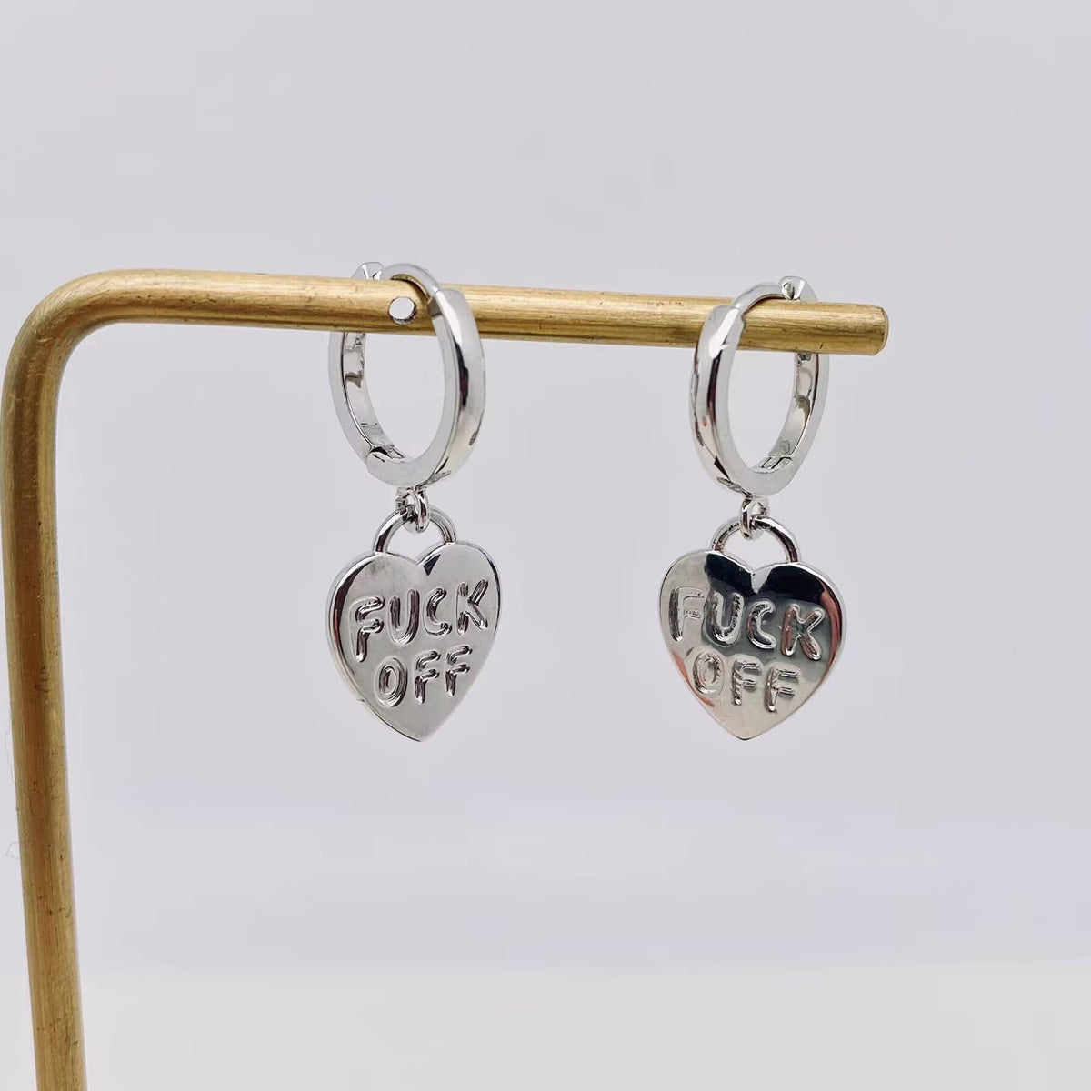 "Fuck off" Heart-shaped Gold Plated Huggie Earrings: Silver - ivyandlavyboutique Mio Queena