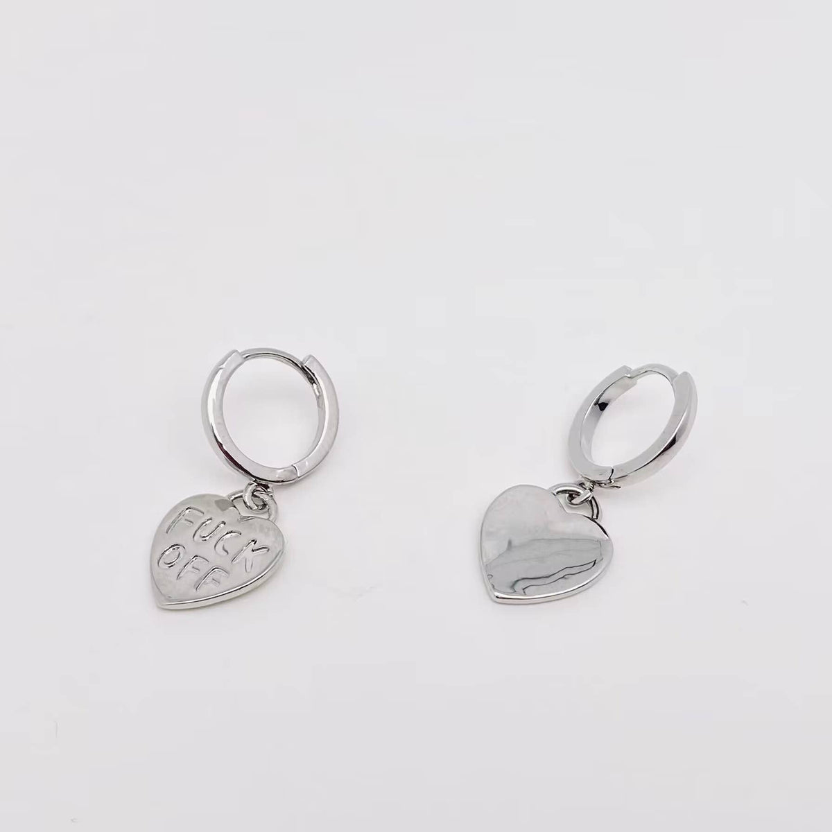 "Fuck off" Heart-shaped Gold Plated Huggie Earrings: Silver - ivyandlavyboutique Mio Queena